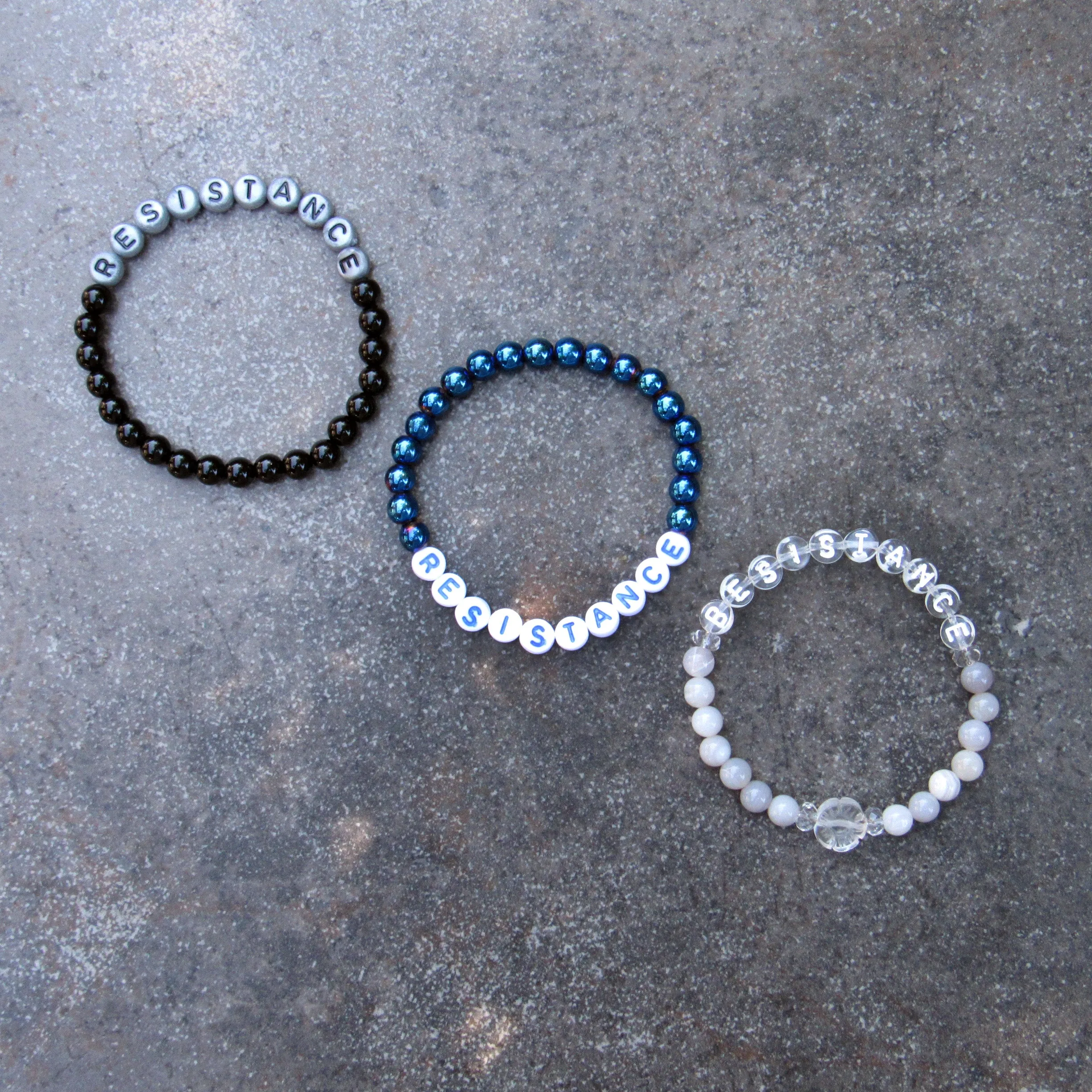 RESISTANCE bracelets in various sizes and gemstones